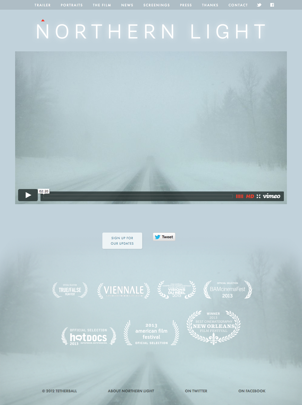 Desktop mockup of Northern Light homepage featuring the theatrical trailer